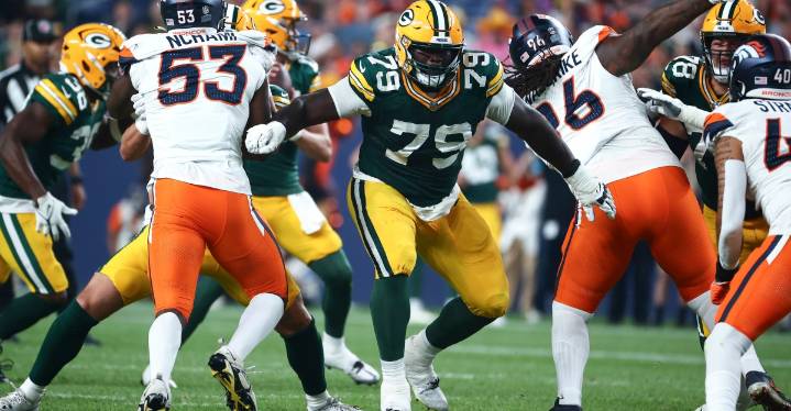Packers place OL on IR, sign WR