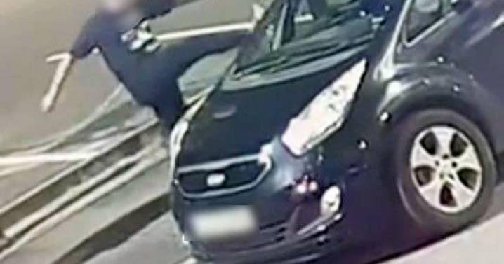 Shocking moment stranger attacks woman's car in Birmingham street 'for the fun of it'
