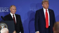 Trump's gift to Putin revealed as dossier found at Alaska hotel detailing lunch menu and how to pronounce Vlad's name