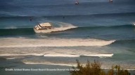 Passenger boat runs aground amid high surf