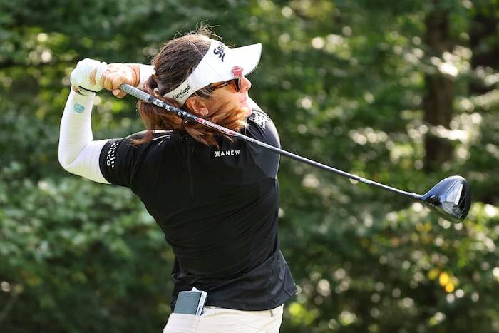 Miranda Wang waits a long time for a short birdie and leads rain