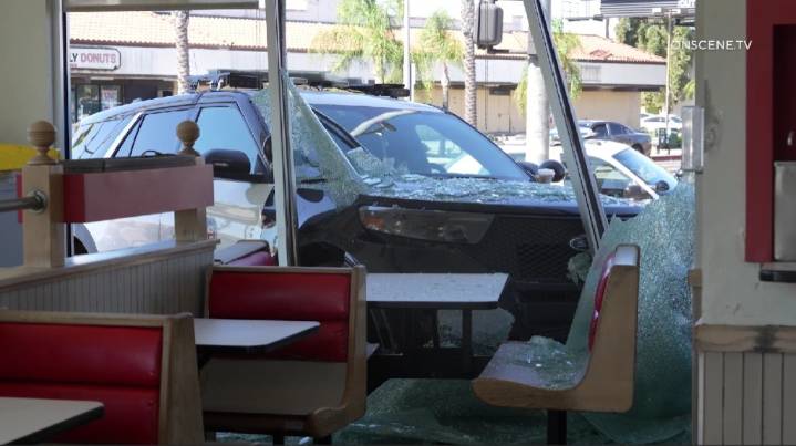 Police SUV crashes into South Gate burger restaurant at end of pursuit