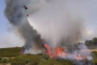 Wildfires across southern Europe force evacuations and kill firefighters