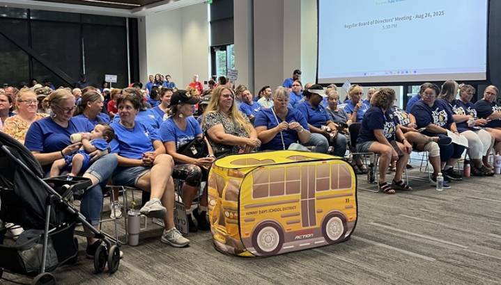 Striking Evergreen workers pack public meeting