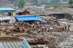Death toll from northwest China floods rises to 13