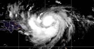 Hurricane Erin, first of Atlantic season, weakens to Category 4. Maps show its path and forecast.