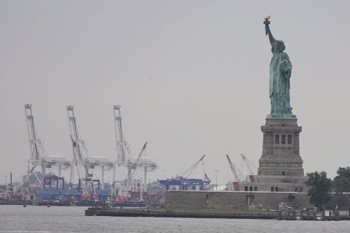 Trump’s new tariffs go into effect as US economy shows signs of strain