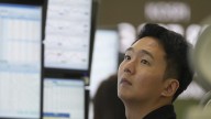 Asian shares are mixed after stocks add a bit to their records on Wall Street