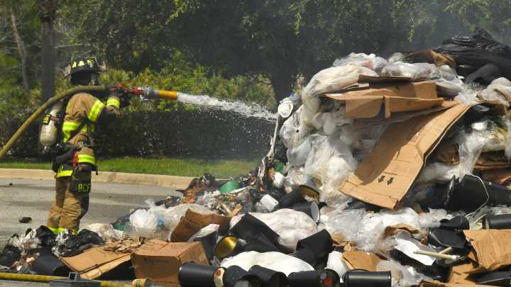 Waste Management driver forced to unload garbage that burst into flames
