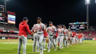 Winn drives in 3 runs, Cardinals take advantage of error in 10th for win over Reds
