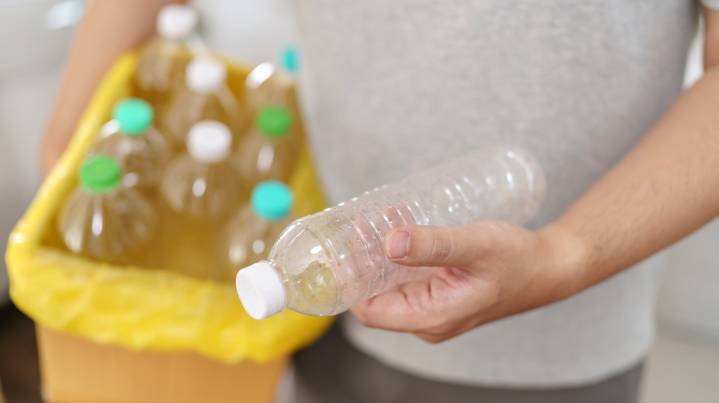 Save Your Empty Plastic Water Bottles To DIY A Nifty Bathroom Storage Solution