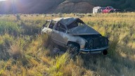 Person ejected from car, pinned under it after rollover crash on I