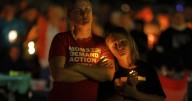 Hundreds honor 2 children killed and 17 people wounded in shooting at a Minneapolis Catholic school
