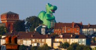 Oggy the dragon is fan favourite at Bristol Balloon Fiesta as picture echoes Godzilla and Chewits advert