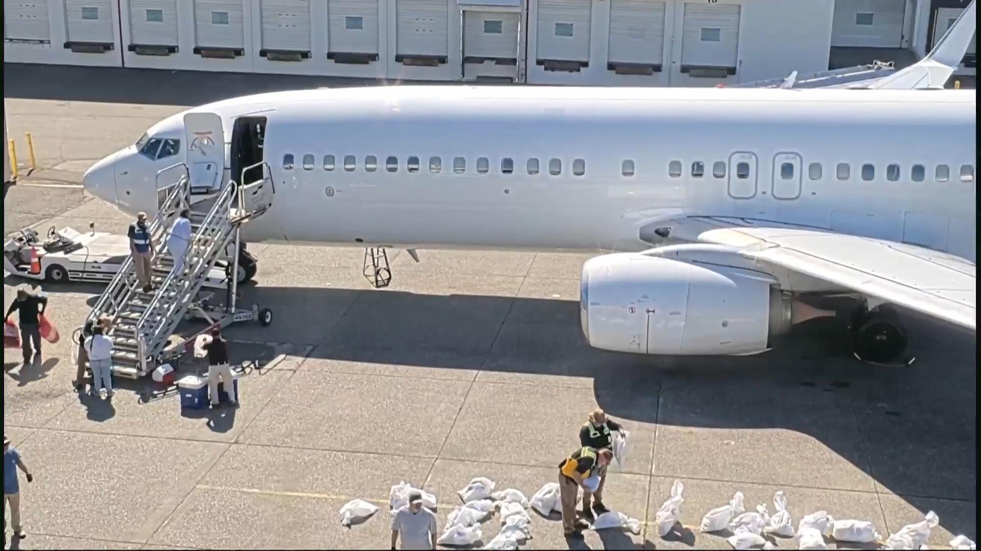 Cameras show ICE transporting immigrants at King County International Airport in Seattle