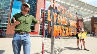Dozens protest US Senator Jon Husted outside Akron Roundtable talk