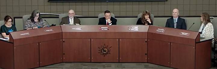 How often the Deer Valley Unified board meets in executive session