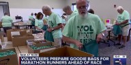Volunteers prepare goodie bags for marathon runners ahead of race