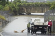 Torrential rains in southern Japan cause flooding, mudslides, and travel disruptions