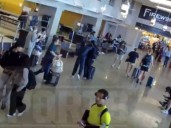 Airport footage shows Olympic champion shoving boyfriend