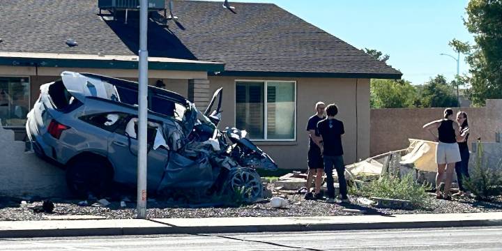 Mesa main road closed after vehicle crashes into wall