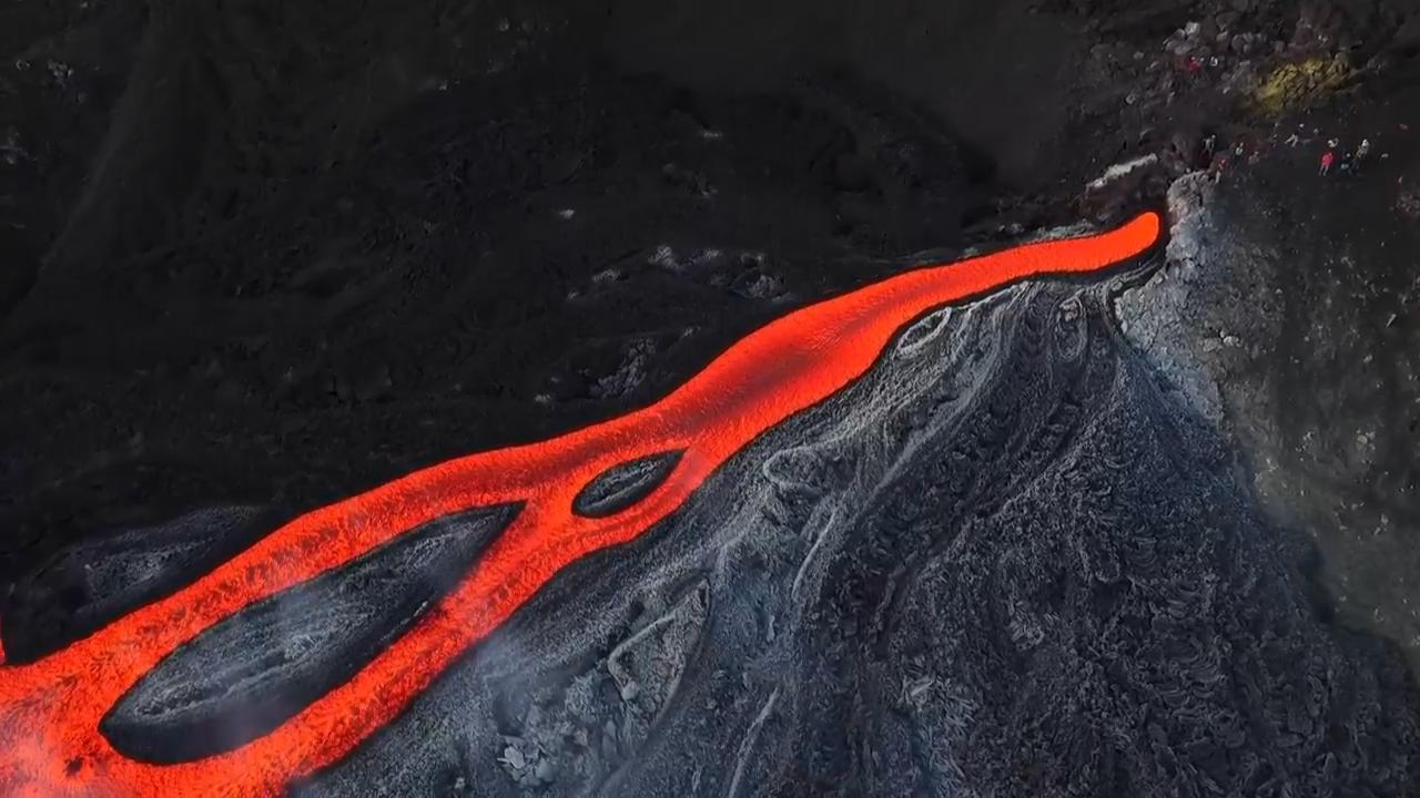 With oozing orange lava flows, Sicily's Mt. Etna provides a breath