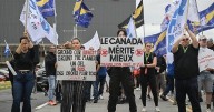 Air Canada passengers still scrambling to rebook as labour dispute grounds flights