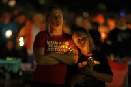 Hundreds honor 2 children killed and 17 people wounded in shooting at a Minneapolis Catholic school