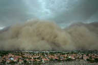 Towering wall of dust rolls through metro Phoenix, leaving tens of thousands without power