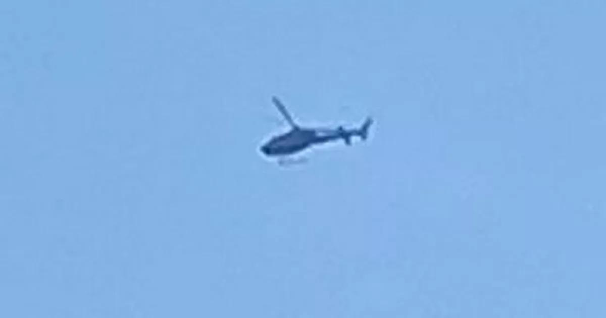 Helicopter filmed mysteriously circling over Manchester city centre