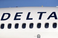 Delta plane wing clips empty aircraft during pushback from gate in Atlanta