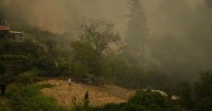 At least 3 dead and thousands displaced as wildfires rage across southern Europe