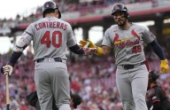 Reds' error in 10th gives Cardinals 7