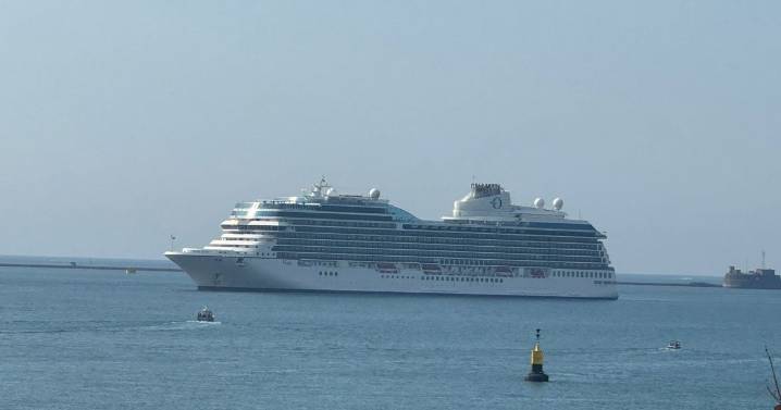 Massive cruise liner dominates views of the sea in Plymouth