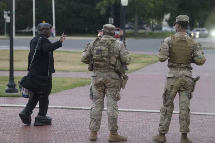 Some National Guard units in Washington are now carrying firearms in escalation of Donald Trump deployment
