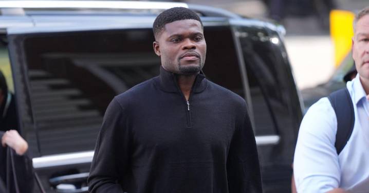 Former Arsenal midfielder Thomas Partey arrives at court to face rape charges