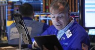 Wall Street ticks lower as more earnings come in ahead of Fed Chair Powell's speech