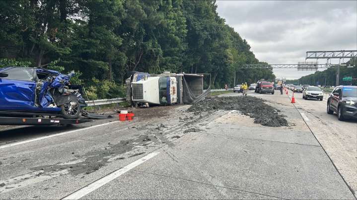 Overturned dump truck disrupts traffic on I