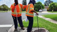 Crews demonstrate how they clear out storm drains across Orange County