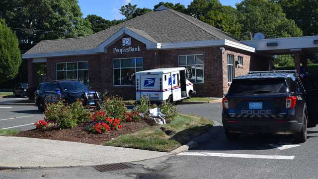 Postal worker was drunk when mail truck struck man , crashed into bank, DA says