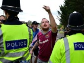 U.K. vows to speed up asylum claims as hotel protests spread