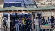 At least 26 dead and a dozen missing after boat capsizes near Italian island