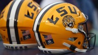 LSU RB JT Lindsey surrenders after warrant alleges he harbored two murder suspects in on