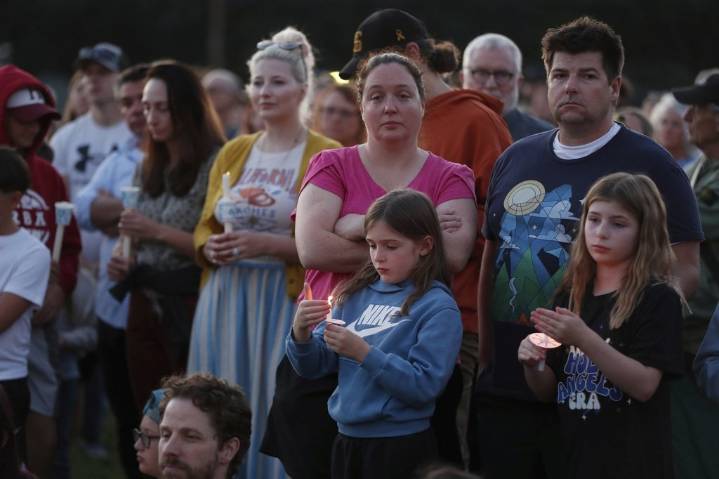 Hundreds honor 2 children killed and 17 people wounded in shooting at a Minneapolis Catholic school