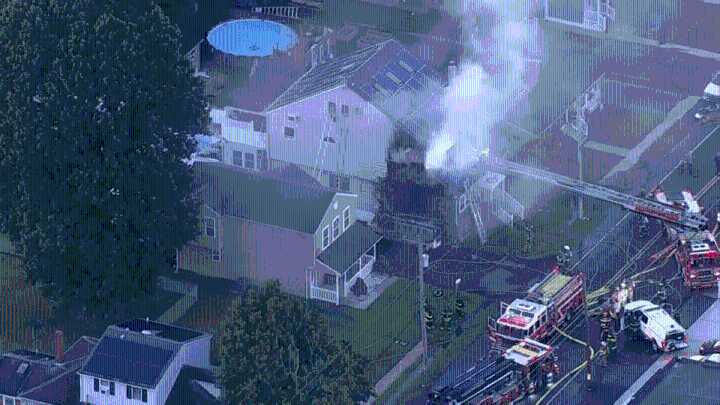 Firefighters battle massive house fire in Bucks County