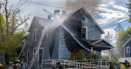 Man in critical condition after rescue from lower South Hill house fire