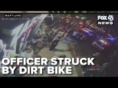 Officer struck by dirt bike in Towson; suspect faces firearm charges