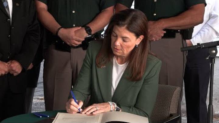 Ceremonial bill signing of N.H. law honors fallen officer, expands 'move over' protections