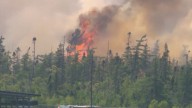 Firefighters battle to contain wildfire in Canada
