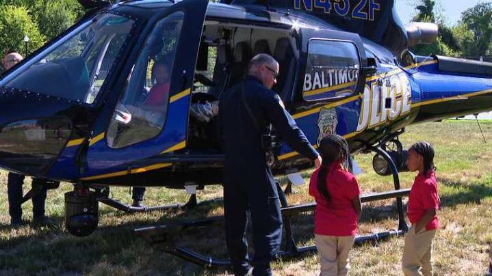Baltimore police’s helicopter surprises kids heading back to school, teach pool safety
